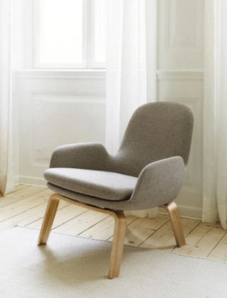 Elegant designer armchairs and sofas offering comfort and style for refined indoor and outdoor living spaces.