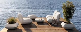 Outdoor cushions and poufs combining softness and weather-resistant design for stylish comfort in open-air spaces.